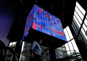 Asian stocks rise on upbeat data, Fed hawks lift dollar